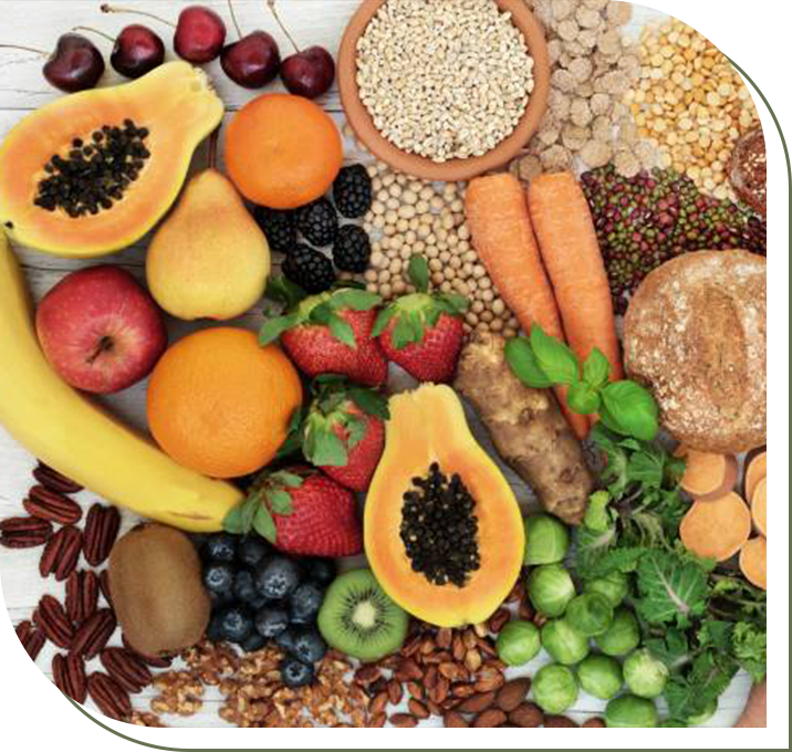 A plate of fruits and nuts on top of the table.