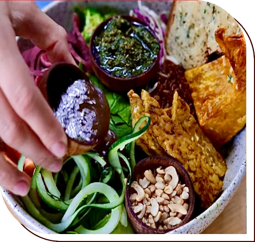 A bowl of food with various ingredients in it.